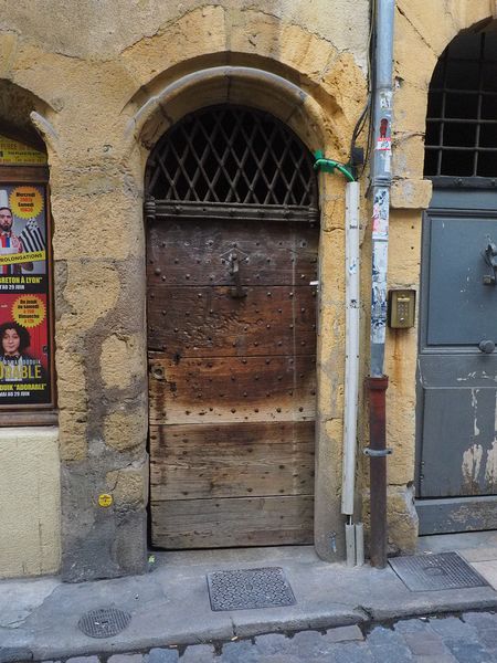 This door leads to a passageway between streets called a traboule